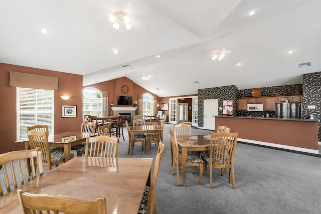4124 Aumbrey Ct, New Albany, OH 43054 - dining room with vaulted ceiling, light carpet, and a fireplace