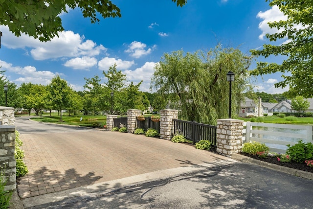4124 Aumbrey Ct, New Albany, OH 43054 - view of road with street lights, curbs, and view of scattered trees