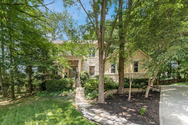1828 Bradford Cir, Newark, OH 43055 - view of property hidden behind natural elements featuring stone siding and stucco siding