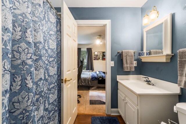 1828 Bradford Cir, Newark, OH 43055 - bathroom with vanity, ensuite bath, a shower with curtain, and wood finished floors