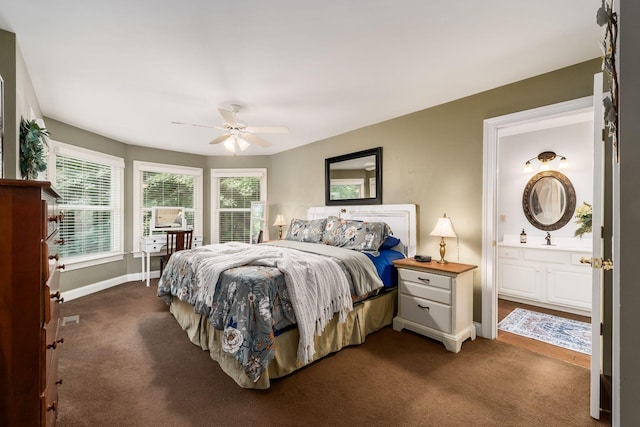 1828 Bradford Cir, Newark, OH 43055 - bedroom with dark colored carpet, multiple windows, a ceiling fan, and ensuite bathroom