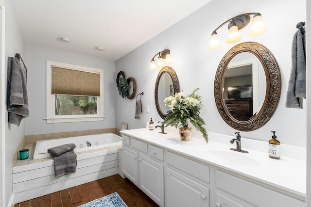 1828 Bradford Cir, Newark, OH 43055 - full bathroom with double vanity, a bath, and wood-type flooring