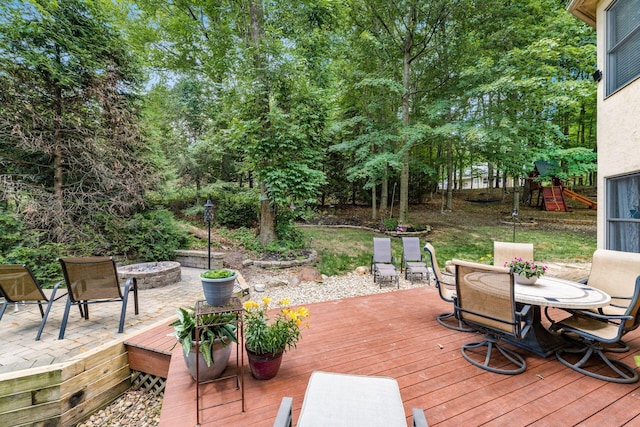 1828 Bradford Cir, Newark, OH 43055 - wooden terrace featuring outdoor dining space, an outdoor fire pit, and a patio