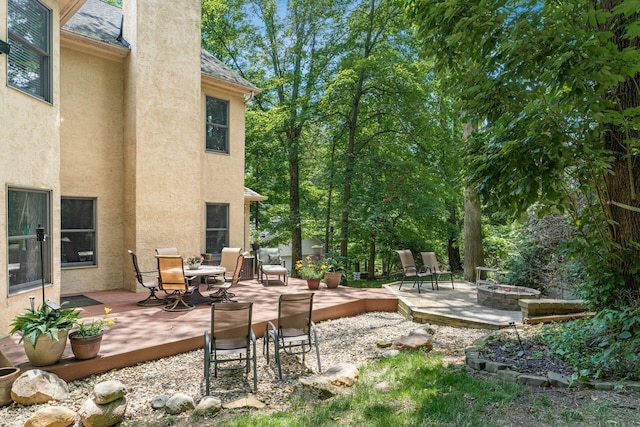 1828 Bradford Cir, Newark, OH 43055 - view of patio / terrace featuring an outdoor fire pit, a wooden deck, and outdoor dining space