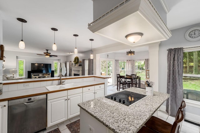 1828 Bradford Cir, Newark, OH 43055 - kitchen with dishwasher, light tile patterned floors, black electric stovetop, and white cabinetry