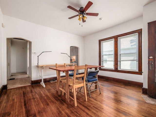 1482 Briarwood Ave, Columbus, OH 43211 - dining space with arched walkways, hardwood / wood-style flooring, and a ceiling fan