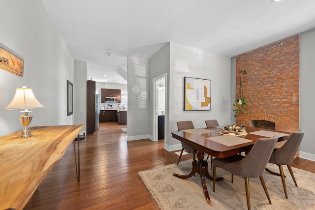 144 Wilson Ave, Columbus, OH 43205 - dining room with dark wood-style floors and baseboards