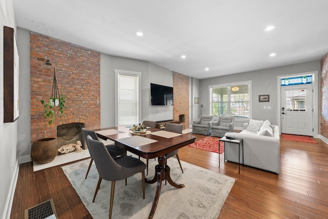 144 Wilson Ave, Columbus, OH 43205 - dining room with a fireplace, wood finished floors, and recessed lighting