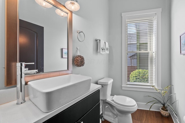 144 Wilson Ave, Columbus, OH 43205 - bathroom with healthy amount of natural light, vanity, and wood finished floors