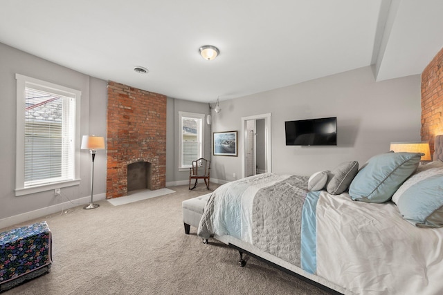144 Wilson Ave, Columbus, OH 43205 - bedroom featuring a brick fireplace and carpet
