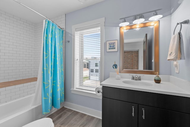 144 Wilson Ave, Columbus, OH 43205 - bathroom with vanity, healthy amount of natural light, shower / bath combination with curtain, and wood finished floors