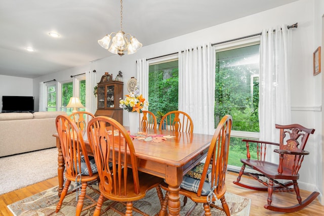 1374 Hanover Ct, Circleville, OH 43113 - dining room with a chandelier and light wood-style flooring