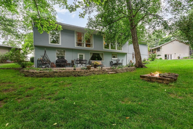 1374 Hanover Ct, Circleville, OH 43113 - back of house featuring an outdoor fire pit, a lawn, and a patio