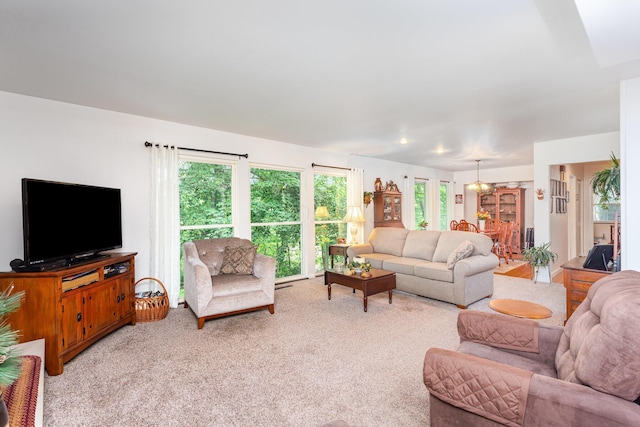 1374 Hanover Ct, Circleville, OH 43113 - living room with light carpet and a chandelier