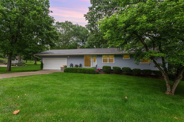 1374 Hanover Ct, Circleville, OH 43113 - ranch-style house with a garage, concrete driveway, a front lawn, a chimney, and a metal roof