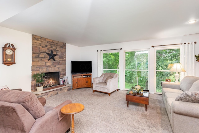 1374 Hanover Ct, Circleville, OH 43113 - living area with carpet flooring, a stone fireplace, and plenty of natural light