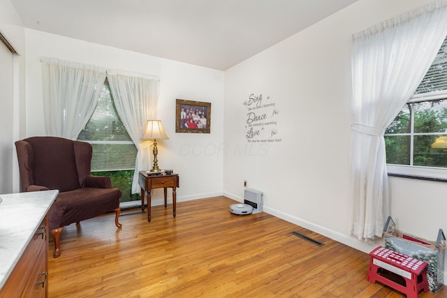 1374 Hanover Ct, Circleville, OH 43113 - living area with light wood-style flooring and baseboards