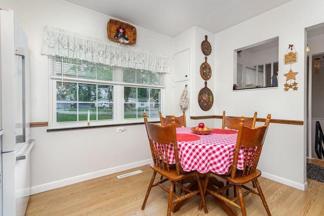 1374 Hanover Ct, Circleville, OH 43113 - dining area with light wood-style floors and baseboards