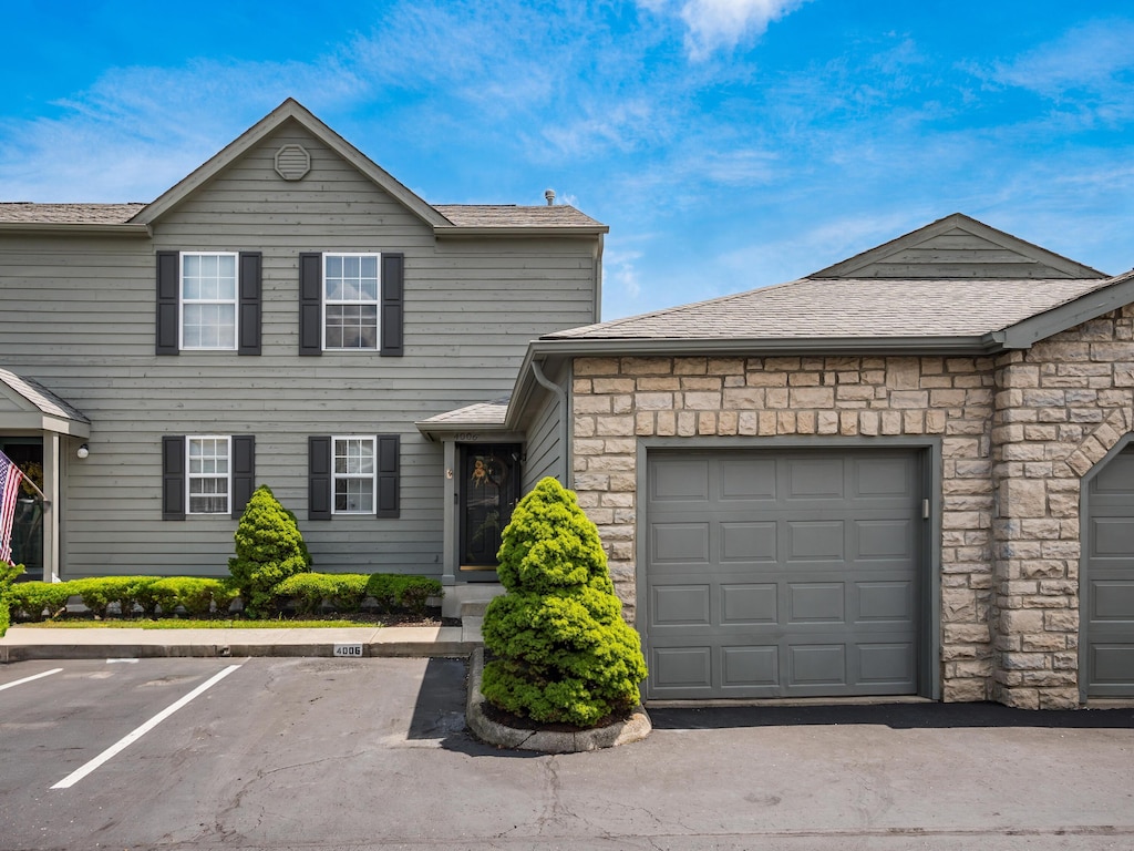 4006 Blendon Grove Way Unit 42D, Columbus, OH 43230 - view of front of home with stone siding and a shingled roof