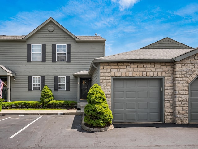 4006 Blendon Grove Way Unit 42D, Columbus, OH 43230 - view of front of home with stone siding and a shingled roof