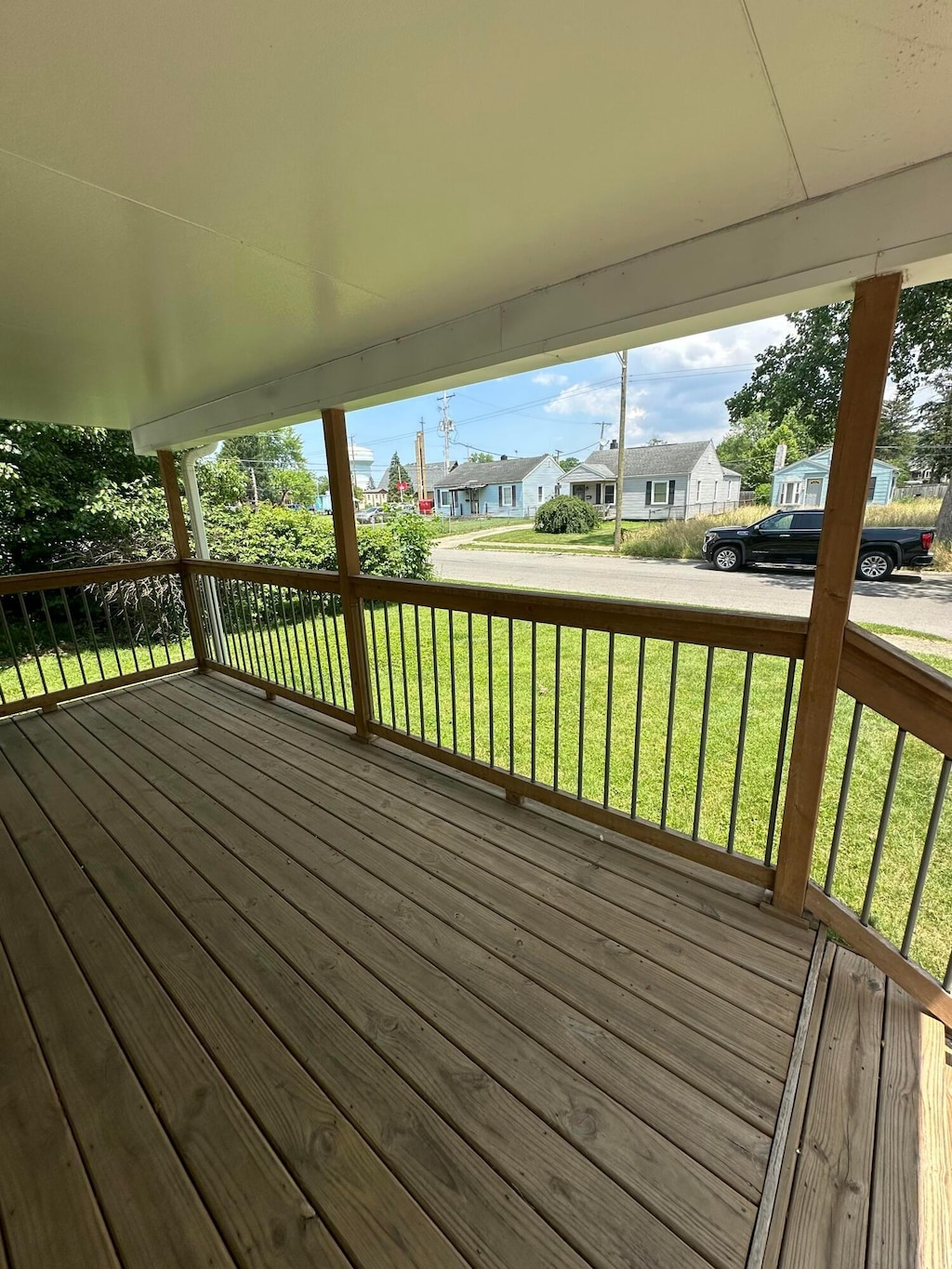 3203 Grasmere Ave, Columbus, OH 43224 - wooden deck with a lawn and a residential view
