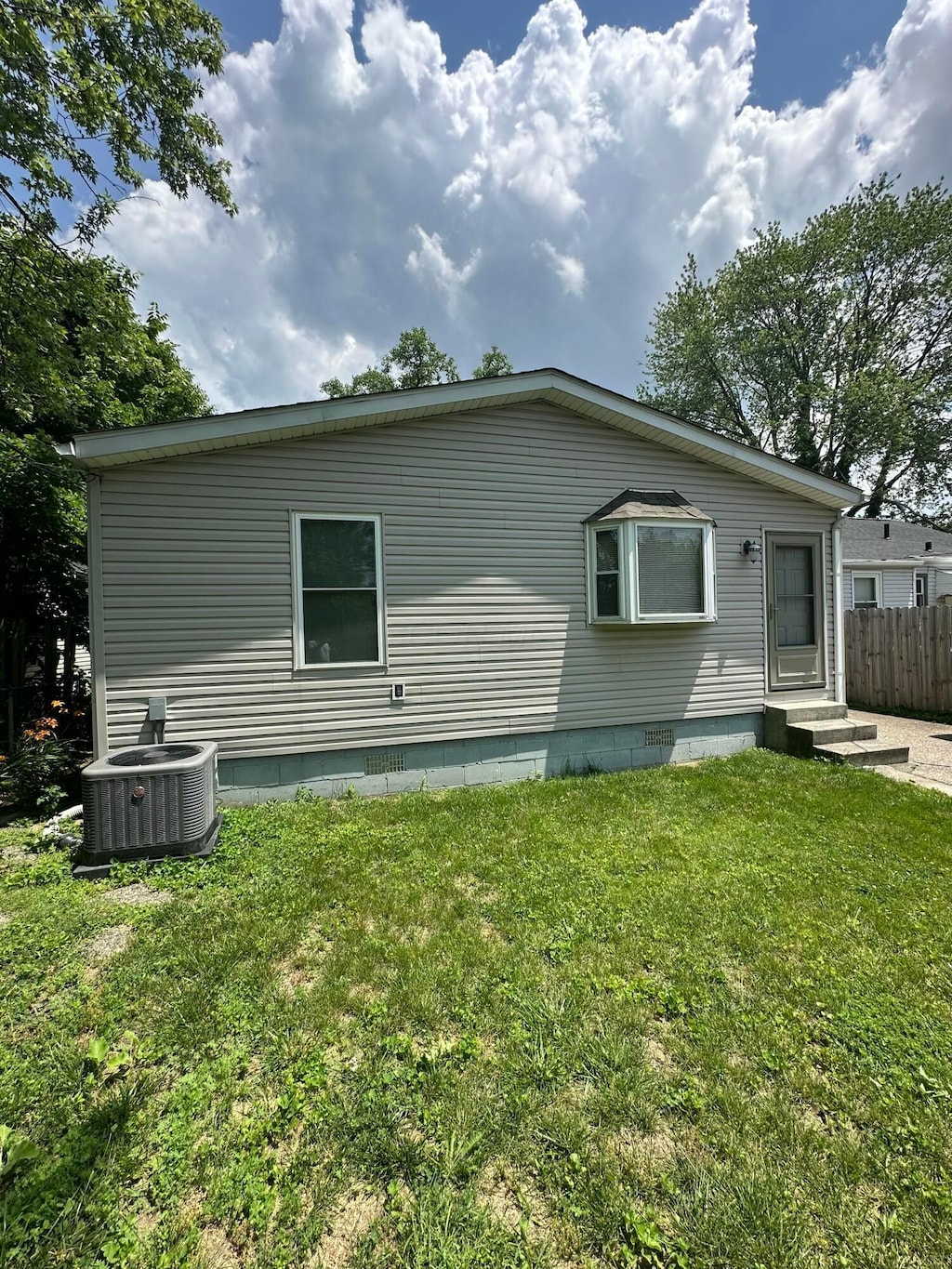 3203 Grasmere Ave, Columbus, OH 43224 - view of home's exterior featuring a central air condition unit