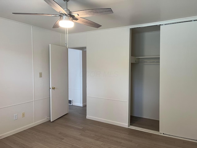 1848 Milden Rd, Columbus, OH 43221 - unfurnished bedroom featuring wood finished floors, a closet, and ceiling fan