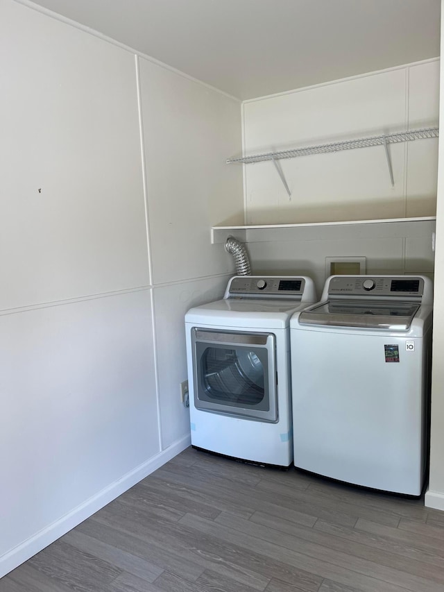 1848 Milden Rd, Columbus, OH 43221 - laundry room with washer and clothes dryer and wood finished floors
