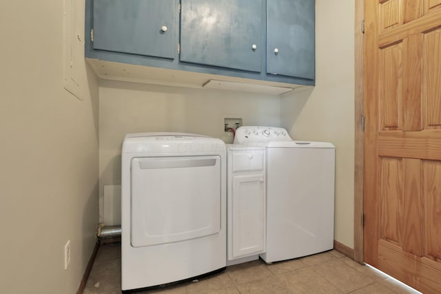 110 Creekview Dr, Baltimore, OH 43105 - laundry area with cabinet space, washer and dryer, and light tile patterned floors