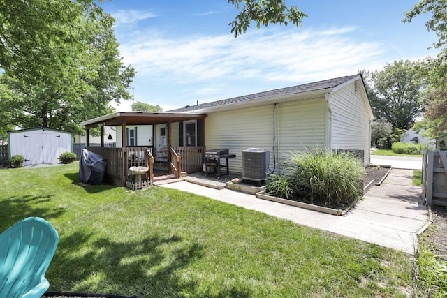 110 Creekview Dr, Baltimore, OH 43105 - back of property with a lawn, a storage unit, and a deck