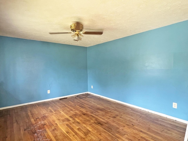 1444 Chesterton Sq N, Columbus, OH 43229 - empty room featuring ceiling fan, wood finished floors, and a textured ceiling