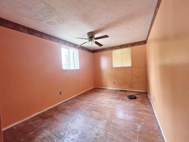 1444 Chesterton Sq N, Columbus, OH 43229 - spare room featuring ceiling fan, hardwood / wood-style flooring, and a textured ceiling