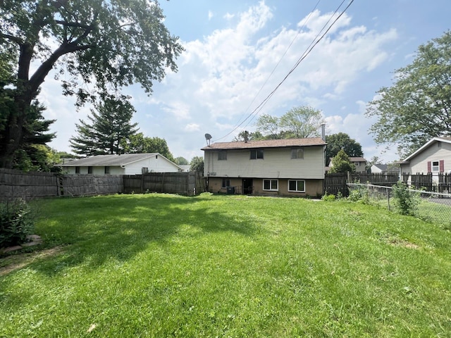 1444 Chesterton Sq N, Columbus, OH 43229 - back of house with a fenced backyard