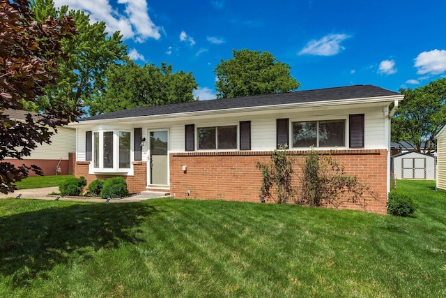 284 Blendon Rd, West Jefferson, OH 43162 - ranch-style house with entry steps, brick siding, a storage unit, and a front yard
