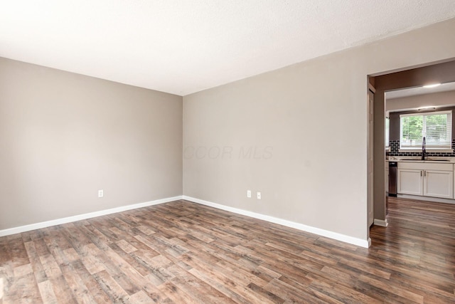 284 Blendon Rd, West Jefferson, OH 43162 - empty room with a sink and wood finished floors