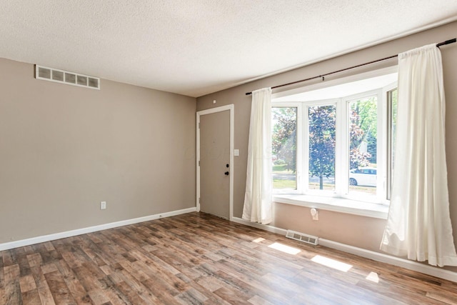 284 Blendon Rd, West Jefferson, OH 43162 - spare room with wood finished floors and a textured ceiling