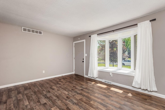 284 Blendon Rd, West Jefferson, OH 43162 - spare room with dark wood-style flooring and a textured ceiling