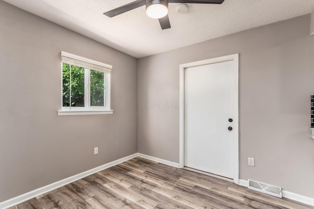 284 Blendon Rd, West Jefferson, OH 43162 - unfurnished room with wood finished floors, ceiling fan, and a textured ceiling
