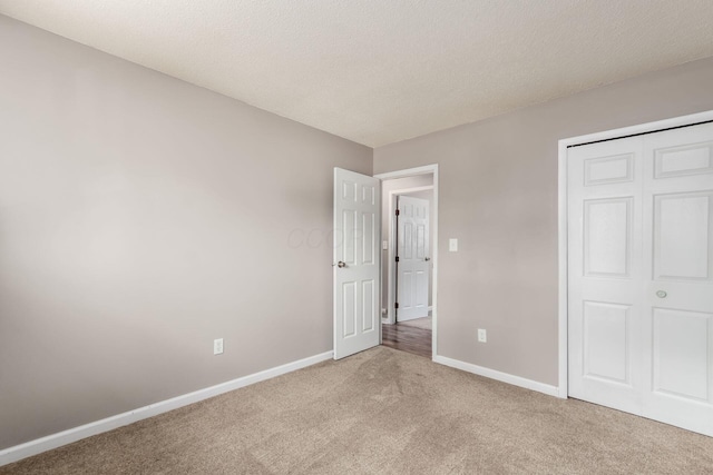 284 Blendon Rd, West Jefferson, OH 43162 - unfurnished bedroom featuring carpet flooring, a textured ceiling, and a closet
