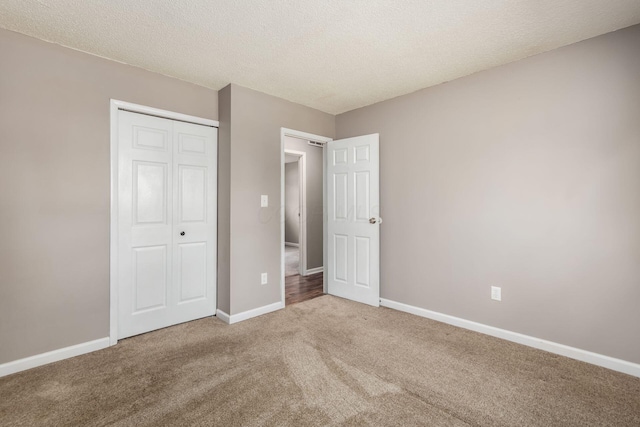 284 Blendon Rd, West Jefferson, OH 43162 - unfurnished bedroom featuring carpet flooring, a closet, and a textured ceiling