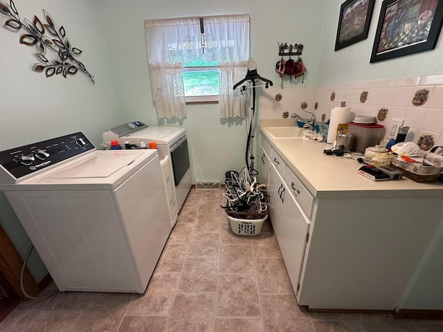 1080 Sycamore Dr, Lancaster, OH 43130 - laundry area featuring cabinet space and washing machine and dryer