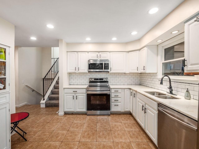 2010 Shallowford Ave, Columbus, OH 43235 - kitchen with stainless steel appliances, backsplash, light countertops, and recessed lighting