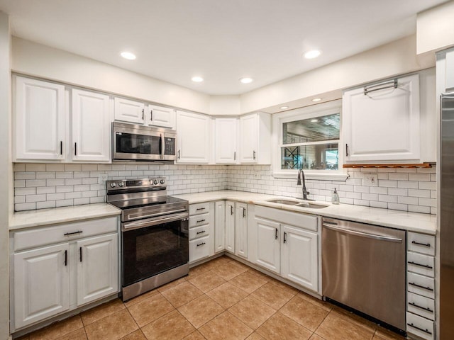 2010 Shallowford Ave, Columbus, OH 43235 - kitchen with stainless steel appliances, white cabinetry, tasteful backsplash, and recessed lighting