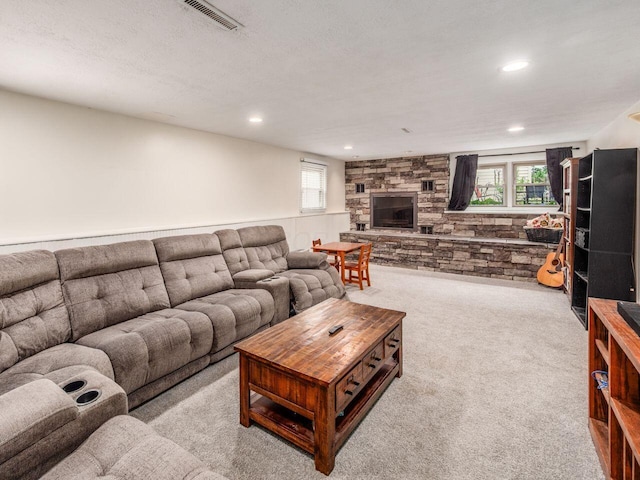 2010 Shallowford Ave, Columbus, OH 43235 - carpeted living room with a stone fireplace, healthy amount of natural light, and recessed lighting
