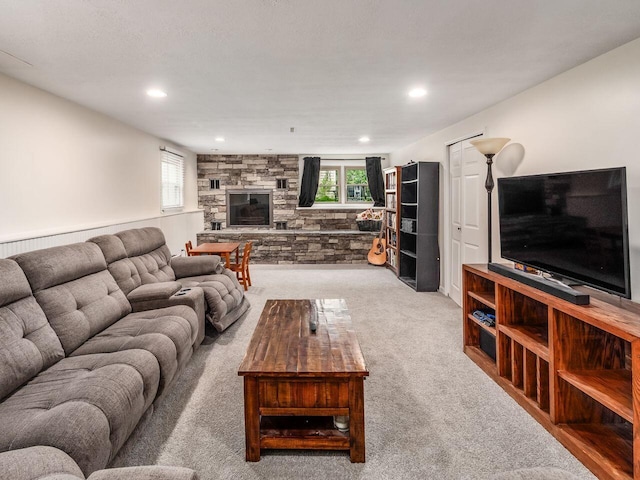 2010 Shallowford Ave, Columbus, OH 43235 - living room featuring light carpet, a stone fireplace, and recessed lighting