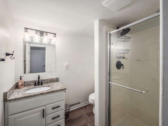 2010 Shallowford Ave, Columbus, OH 43235 - bathroom with a shower stall, vanity, and wood finished floors