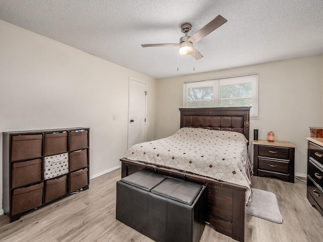 2010 Shallowford Ave, Columbus, OH 43235 - bedroom with light wood-style flooring, a textured ceiling, and a ceiling fan