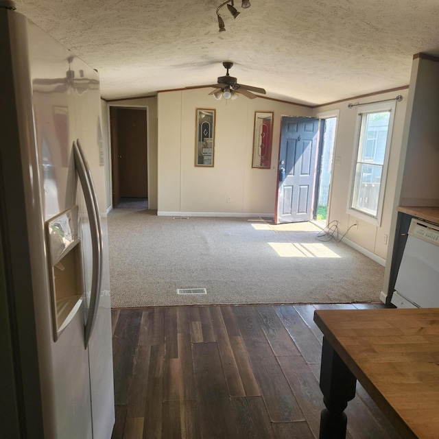 3137 Westerville Rd Unit 91, Columbus, OH 43224 - unfurnished living room featuring a ceiling fan, dark wood finished floors, a textured ceiling, and vaulted ceiling