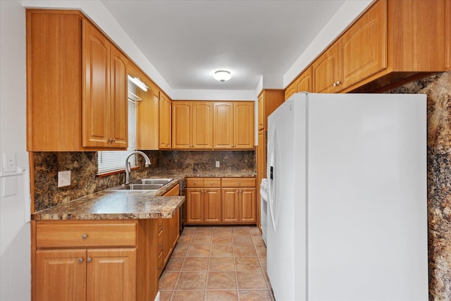 3457 Homecroft Dr, Columbus, OH 43224 - kitchen featuring white refrigerator with ice dispenser, decorative backsplash, brown cabinets, and dark countertops