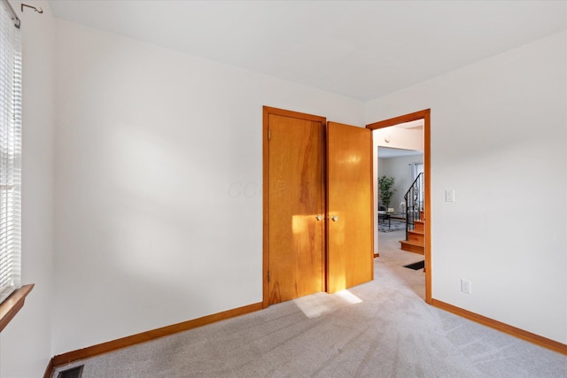 3457 Homecroft Dr, Columbus, OH 43224 - spare room with baseboards and light colored carpet